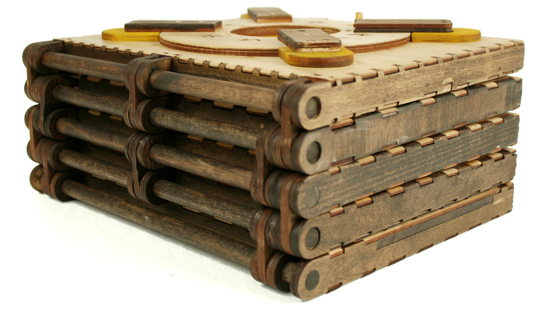 Illustration for article titled You Must Solve a Puzzle to Turn Every Page in This Beautiful Wooden Book